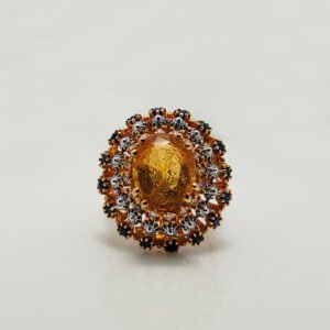 A Ring with Golden Topaz, Sapphires and zircons