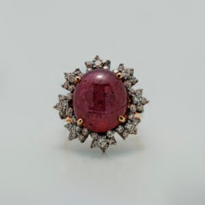 A Ring with Cabochon Ruby and zircons