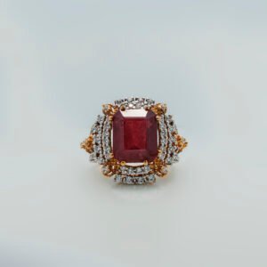 A ring with Ruby and zircons