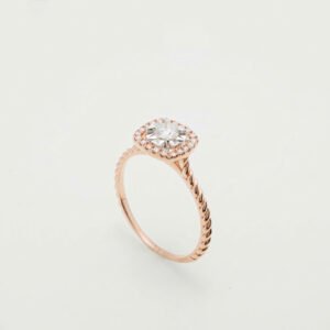 A radiant diamond halo set in luxurious 18K gold
